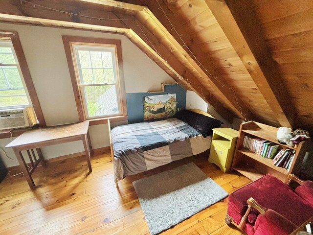 6 Alfano Dr, Enfield, NH 03748 - bedroom with hardwood / wood-style flooring, lofted ceiling, multiple windows, and cooling unit