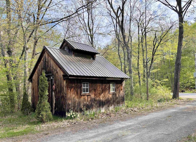 6 Alfano Dr, Enfield, NH 03748 - view of home's exterior featuring a metal roof and a wooded view