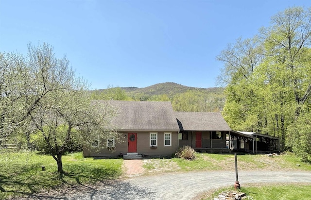 6 Alfano Dr, Enfield, NH 03748 - single story home with dirt driveway, a mountain view, and a shingled roof