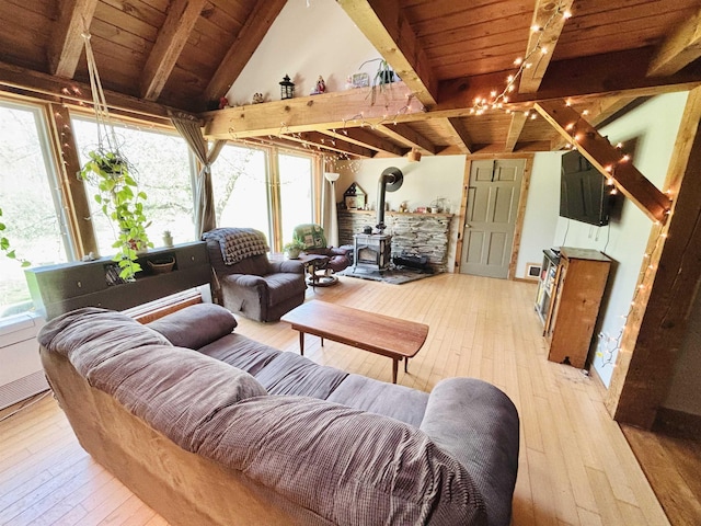 6 Alfano Dr, Enfield, NH 03748 - living area featuring hardwood / wood-style floors, a wood stove, and a wooden ceiling with exposed beams
