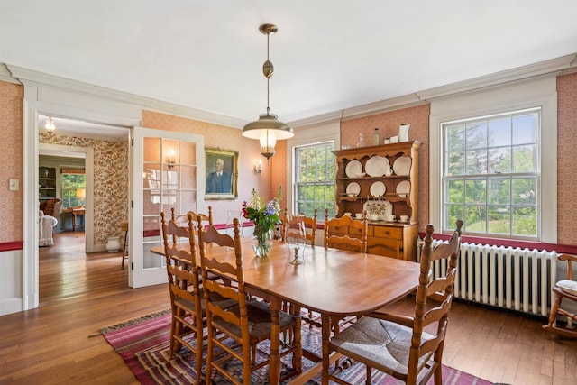 84 S Main St, Hanover, NH 03755 - dining room featuring radiator, wallpapered walls, ornamental molding, hardwood / wood-style flooring, and healthy amount of natural light