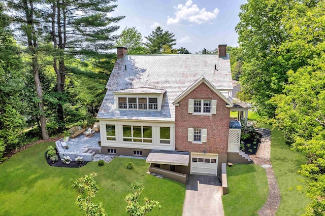 84 S Main St, Hanover, NH 03755 - back of property featuring a high end roof, an attached garage, a chimney, and driveway