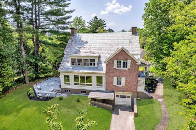 84 S Main St, Hanover, NH 03755 - rear view of house with a chimney, a high end roof, and an attached garage