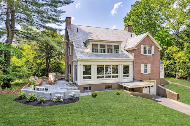 84 S Main St, Hanover, NH 03755 - back of house with a high end roof, an attached garage, a chimney, concrete driveway, and a yard
