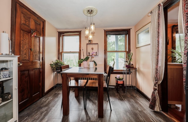 26 Verona St, Nashua, NH 03060 - dining space featuring dark wood-type flooring and radiator heating unit