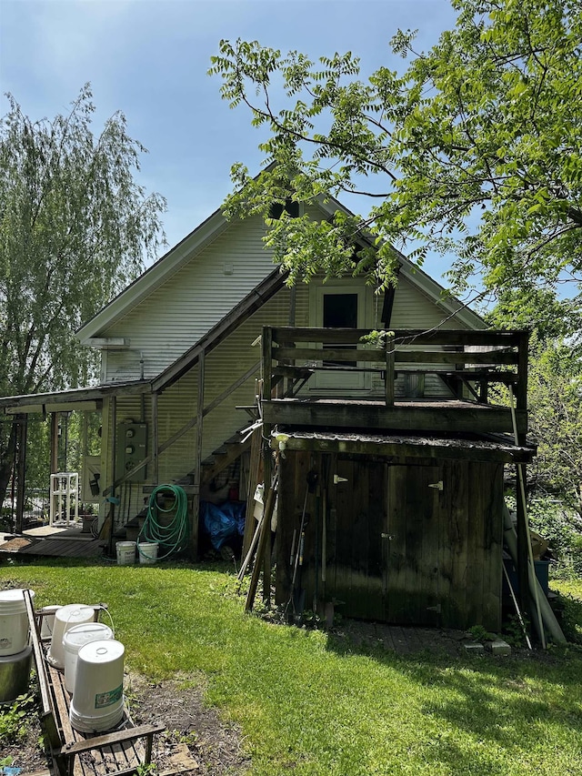 53 High St, Middlebury, VT 05753 - back of house with a deck and a lawn