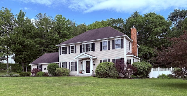 290 Elm St, Littleton, NH 03561 - colonial-style house with a chimney