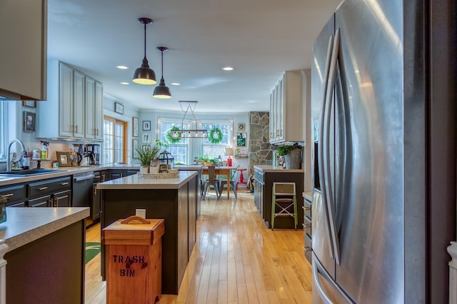 290 Elm St, Littleton, NH 03561 - kitchen with appliances with stainless steel finishes, light wood-style floors, light countertops, pendant lighting, and recessed lighting