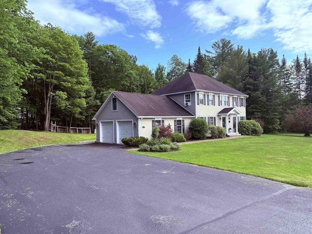 290 Elm St, Littleton, NH 03561 - colonial house with a garage, asphalt driveway, and a front lawn