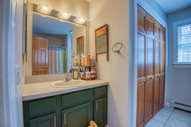 290 Elm St, Littleton, NH 03561 - bathroom featuring a baseboard heating unit, vanity, and tile patterned floors