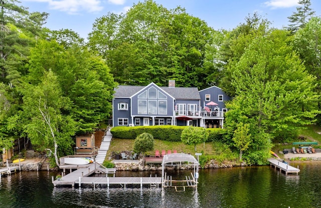 20 Bennett Cir, Antrim, NH 03440 - rear view of house featuring a water view, stairs, boat lift, and a chimney