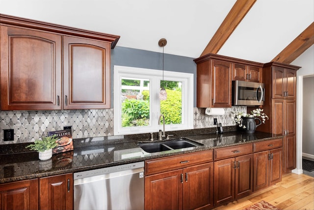 20 Bennett Cir, Antrim, NH 03440 - kitchen with appliances with stainless steel finishes, light wood-type flooring, dark stone counters, decorative backsplash, and pendant lighting