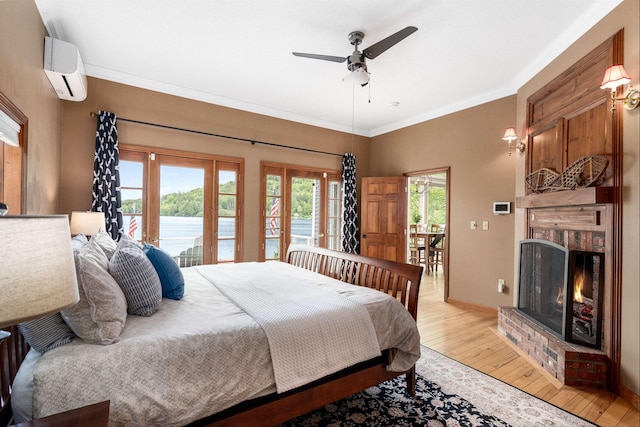 20 Bennett Cir, Antrim, NH 03440 - bedroom with access to outside, light wood-style floors, a wall mounted AC, french doors, and crown molding