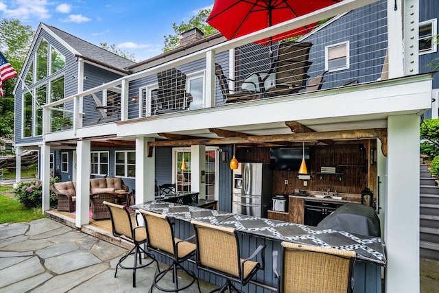 20 Bennett Cir, Antrim, NH 03440 - back of house with an outdoor living space, a balcony, a chimney, and a patio