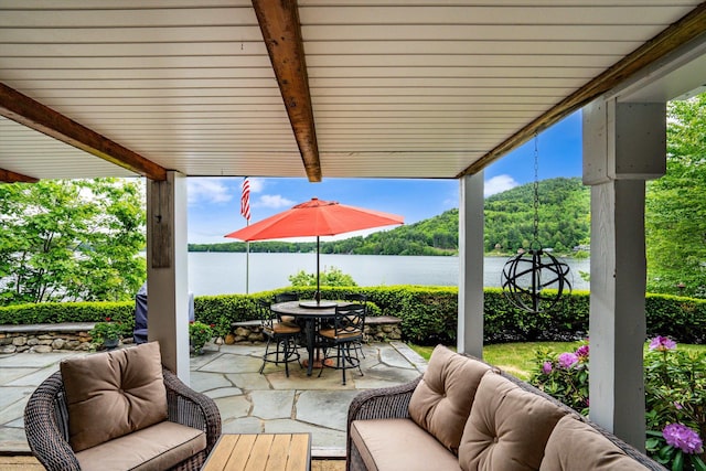 20 Bennett Cir, Antrim, NH 03440 - view of patio / terrace featuring an outdoor living space, outdoor dining area, and a water view