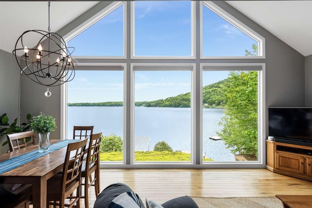 20 Bennett Cir, Antrim, NH 03440 - dining area featuring a chandelier, healthy amount of natural light, wood finished floors, and high vaulted ceiling