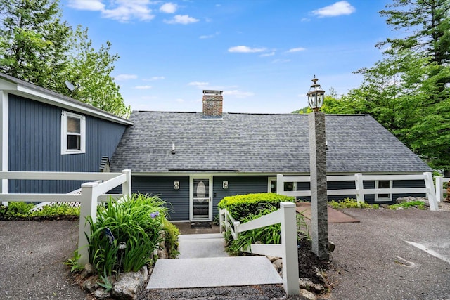 20 Bennett Cir, Antrim, NH 03440 - view of front facade with a shingled roof and a chimney