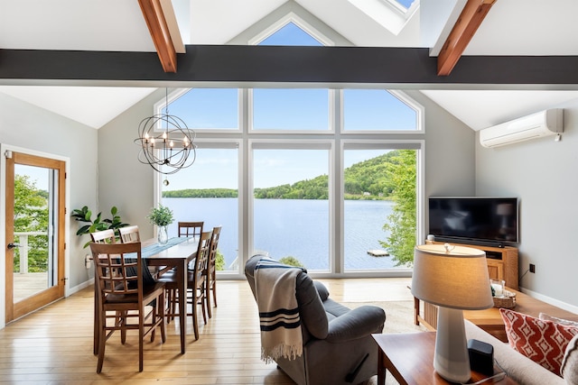 20 Bennett Cir, Antrim, NH 03440 - living room featuring a wall mounted AC, a chandelier, and light wood-type flooring