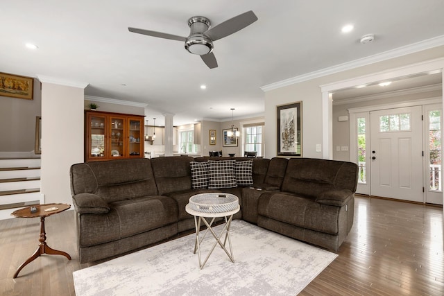 16 Boulder Dr, Newmarket, NH 03857 - living room featuring a ceiling fan, stairs, wood finished floors, decorative columns, and ornamental molding