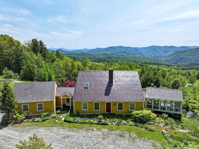 1074 N Hollow Rd, Rochester, VT 05767 - aerial view of property and surrounding area featuring a heavily wooded area and a mountainous background