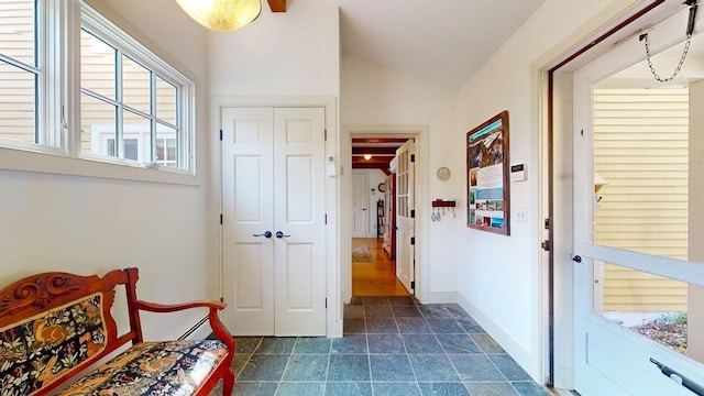 1074 N Hollow Rd, Rochester, VT 05767 - corridor with lofted ceiling, plenty of natural light, and dark stone finish flooring