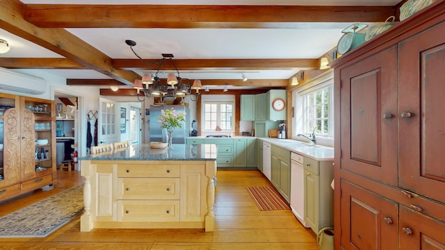 1074 N Hollow Rd, Rochester, VT 05767 - kitchen featuring a chandelier, white dishwasher, light wood finished floors, freestanding refrigerator, and beamed ceiling