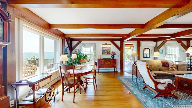 1074 N Hollow Rd, Rochester, VT 05767 - dining room featuring light wood-style floors, beam ceiling, a baseboard radiator, a mountain view, and a wall unit AC