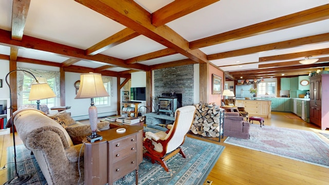 1074 N Hollow Rd, Rochester, VT 05767 - living area with beam ceiling, healthy amount of natural light, and light wood finished floors