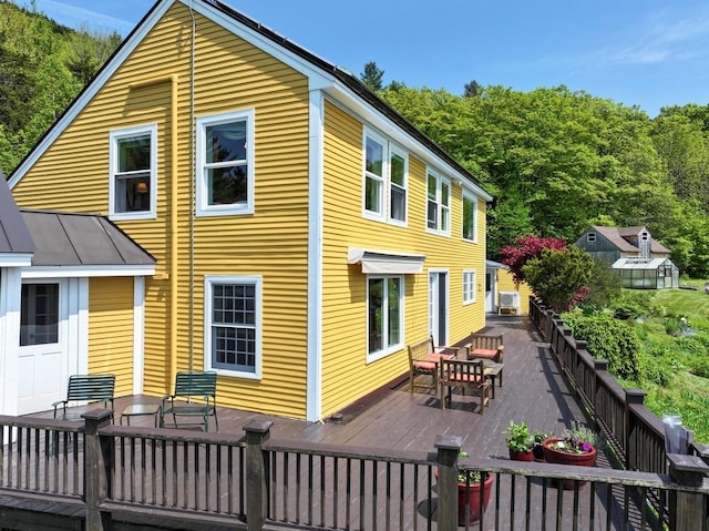 1074 N Hollow Rd, Rochester, VT 05767 - rear view of house featuring outdoor dining space and a wooden deck