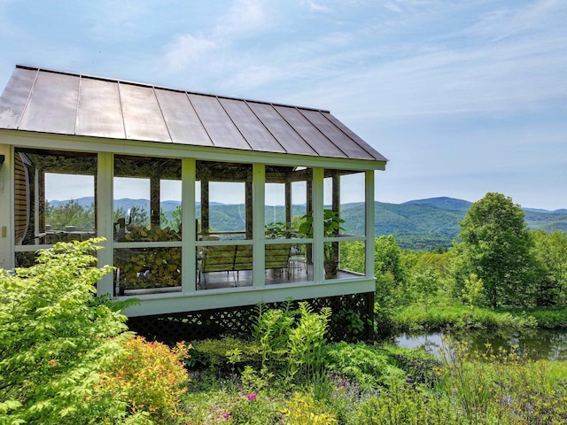 1074 N Hollow Rd, Rochester, VT 05767 - view of side of home with a mountain view and a sunroom