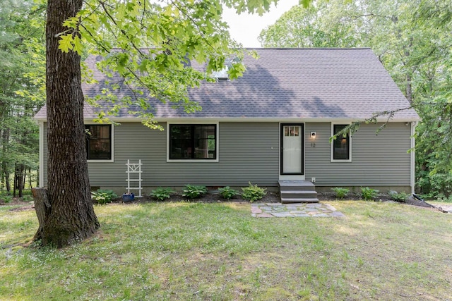 12 Garrison Ln, Madbury, NH 03823 - view of front facade with a front lawn and roof with shingles