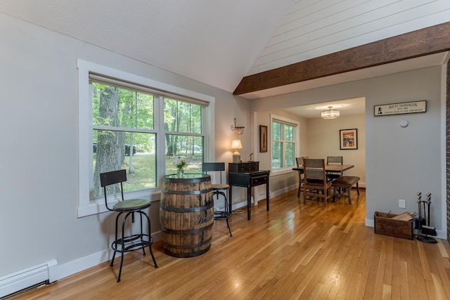 12 Garrison Ln, Madbury, NH 03823 - dining area featuring a baseboard heating unit, vaulted ceiling, and light wood finished floors