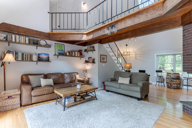 12 Garrison Ln, Madbury, NH 03823 - living room with wood finished floors, stairs, and a high ceiling