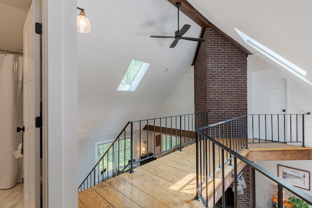 12 Garrison Ln, Madbury, NH 03823 - staircase with a skylight, ceiling fan, and wood finished floors