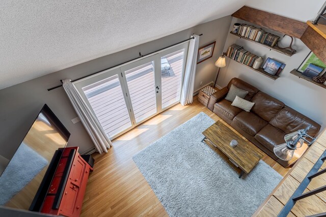 12 Garrison Ln, Madbury, NH 03823 - living room with wood finished floors and a textured ceiling