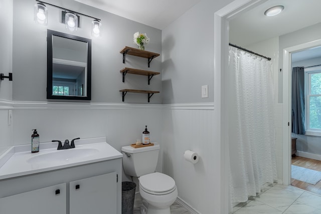 12 Garrison Ln, Madbury, NH 03823 - bathroom with vanity, a wainscoted wall, marble look tile flooring, and curtained shower