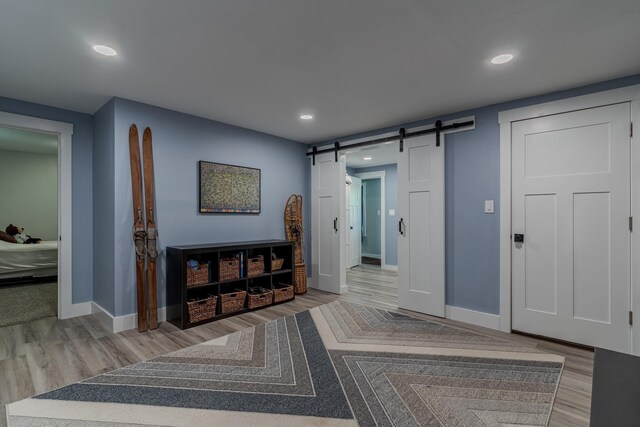 12 Garrison Ln, Madbury, NH 03823 - corridor with a barn door, wood finished floors, and recessed lighting