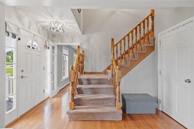 10 Jeremy Hill Rd, Pelham, NH 03076 - entryway with stairway, hardwood / wood-style floors, a baseboard radiator, and a chandelier
