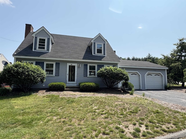 28 Old Orchard Way, Manchester, NH 03103 - cape cod home featuring a chimney, driveway, a front yard, entry steps, and a garage