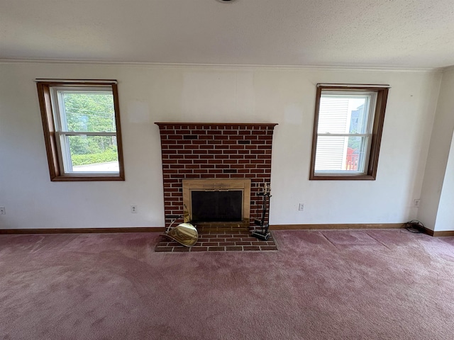 28 Old Orchard Way, Manchester, NH 03103 - unfurnished living room featuring ornamental molding, carpet, a brick fireplace, and a textured ceiling