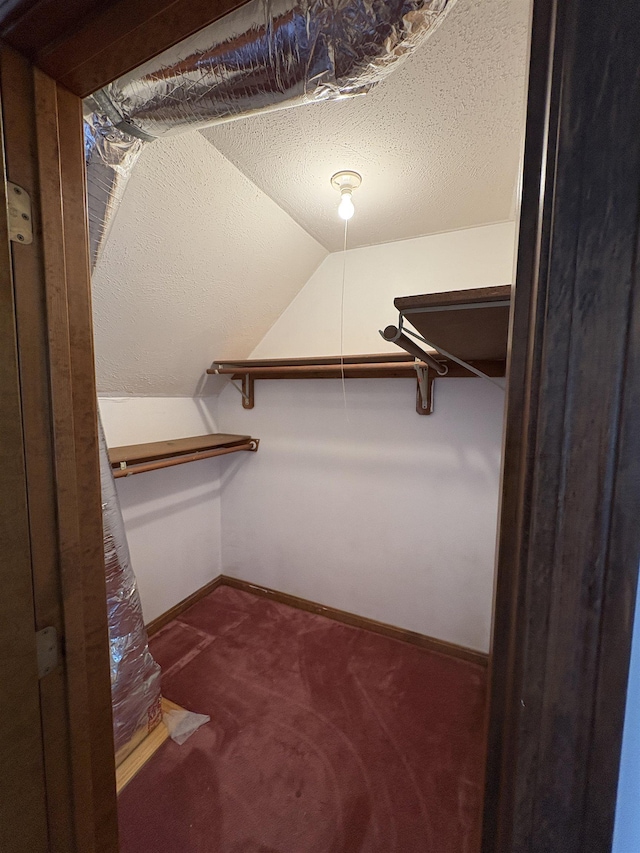 28 Old Orchard Way, Manchester, NH 03103 - spacious closet featuring vaulted ceiling and carpet floors