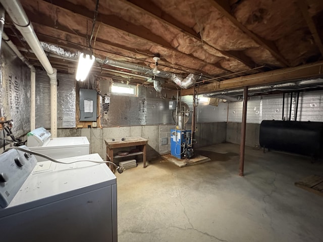 28 Old Orchard Way, Manchester, NH 03103 - basement featuring separate washer and dryer, oil tank, electric panel, and a heating unit