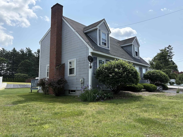 28 Old Orchard Way, Manchester, NH 03103 - view of home's exterior featuring a chimney and a lawn