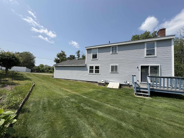 28 Old Orchard Way, Manchester, NH 03103 - back of property featuring a chimney, a deck, and a yard
