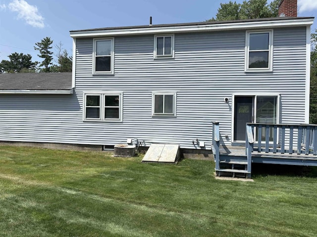 28 Old Orchard Way, Manchester, NH 03103 - back of property featuring a chimney, a deck, and a lawn
