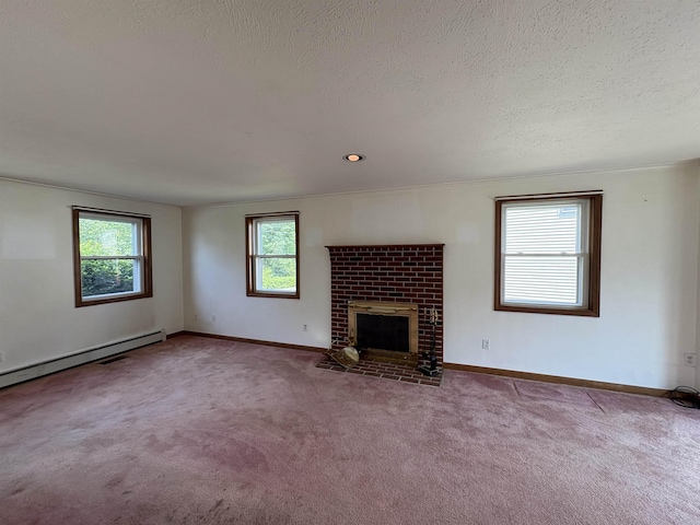 28 Old Orchard Way, Manchester, NH 03103 - unfurnished living room featuring carpet flooring, a fireplace, a textured ceiling, healthy amount of natural light, and a baseboard radiator