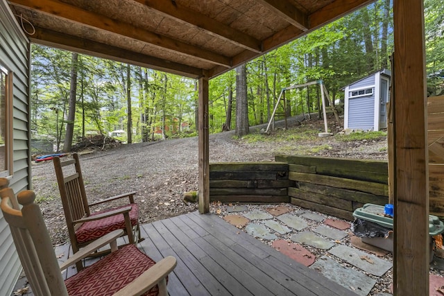 23 E Shore Dr, Greene, ME 04236 - wooden deck with a storage shed and view of scattered trees