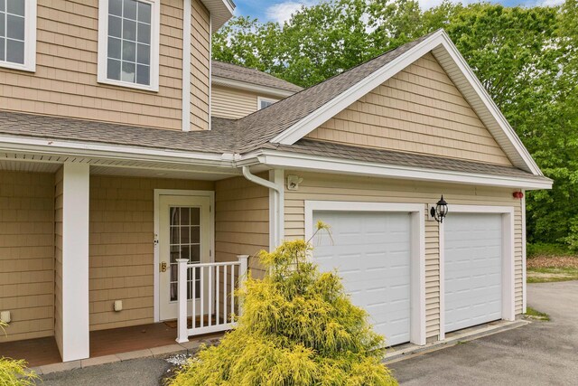 116 Piscataqua Rd Unit C, Durham, NH 03824 - view of side of home with roof with shingles and a garage