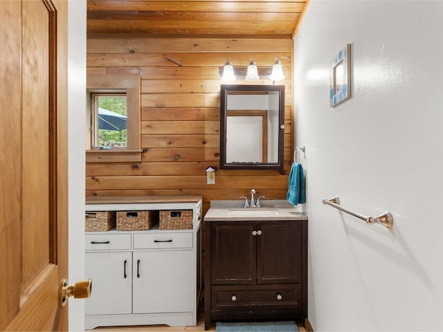 1716 US Route 2, Moretown, VT 05676 - bathroom with vanity, wood walls, and wood ceiling