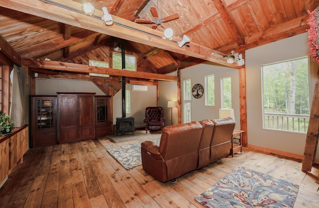 1448 Bound Tree Rd, Hopkinton, NH 03229 - living room with light wood finished floors, a wood stove, wooden ceiling, and a wall mounted air conditioner